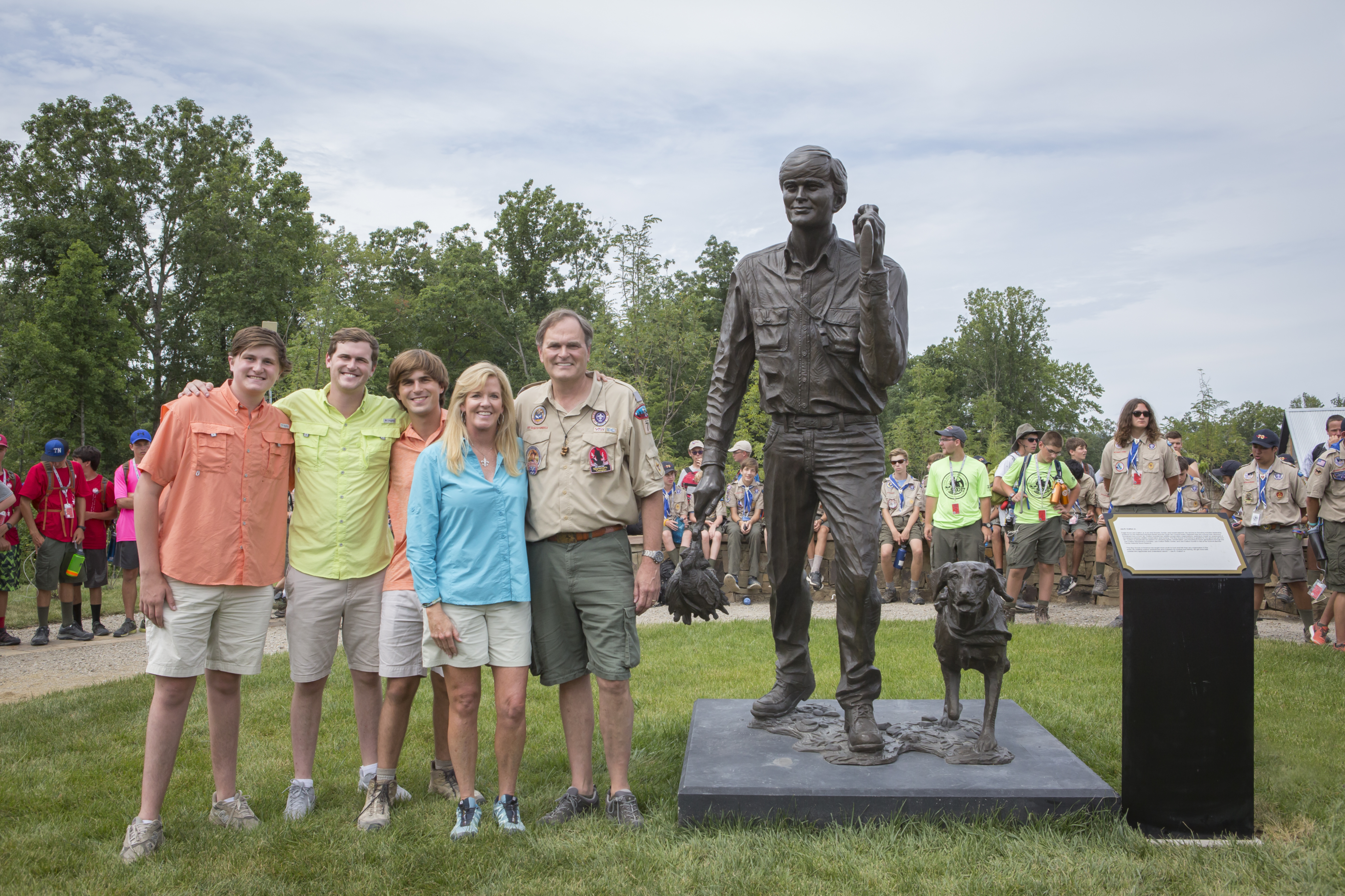 Joe Crafton Jr his three sons and his wife Amy Simmons Crafton standing next to statue at sportsman complex in west virginia for bsa sportsman